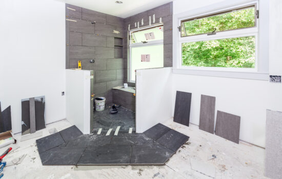 A white and grey bathroom being remodeled in El Paso.